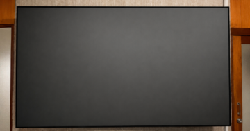 Genius Screen Optical 8K 100-inch projection screen installed for a premium home theater by HDT Homedigital.