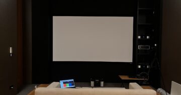 Home Theater with Epson EH-LS12000 projector and Genius Screen Acoustic Transparent 8K 150-inch screen during Video Calibration by HDT Homedigital.